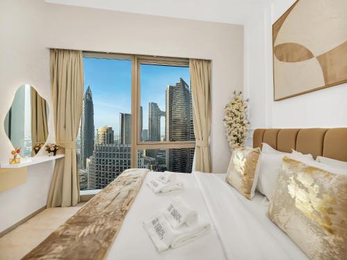 Postel nebo postele na pokoji v ubytování Grandeur 2 Bedroom Apartments I Burj Khalifa & Fountain Views I Free Parking, Gym, Pool, Wi-Fi & PS5 I by Skyline Serenity