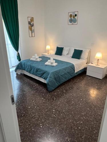 a bedroom with a large bed and two tables at Laura Home in Verona