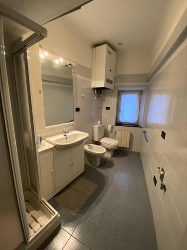 a bathroom with a sink and a toilet at Martel Rooms - Genova Centro Brignole in Genoa