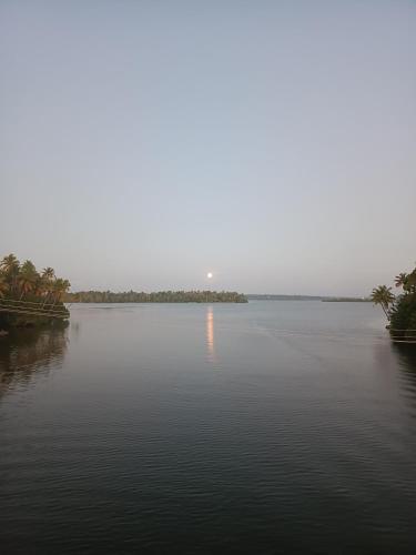 a view of a large body of water at Bliss Homestay Munroe Island in Munroe Island