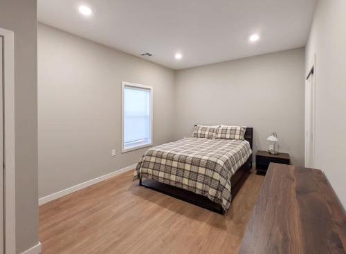 a bedroom with a bed and a window at 213 Brand New 3 Bedroom 2 Bath 1 Full Kit 1 Liv in Dunellen