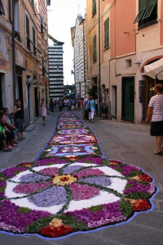 a street with a large flower arrangement on the street at Zia Letizia Bed And Wine in Monterosso al Mare