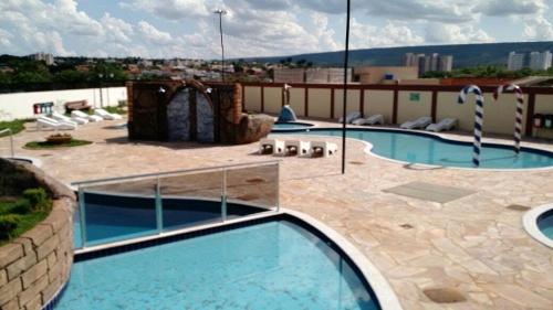a large swimming pool on top of a building at Golden Dolphin Supreme in Caldas Novas