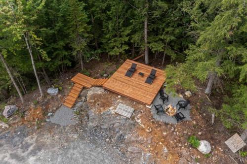 an overhead view of a house with chairs and a table at Ultra Luxurious Modern Chalet Private Jacuzzi in La Conception