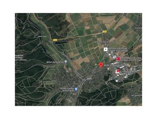 a map of a city with a red circle at Mülli's Ferienwohnung Eifel in Kall