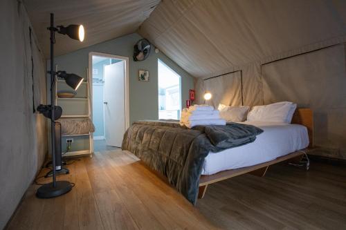 a bedroom with a large bed in a room at South Coast Retreat in Greenwell Point