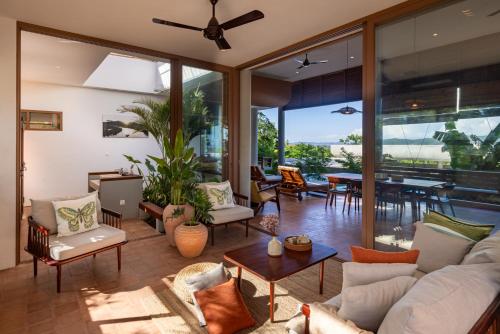 a living room with a couch and a table at Amaya Kampot Homestays in Kampot