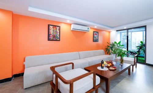 a living room with a couch and a table at Hai Yen Apartment in Sa Pa