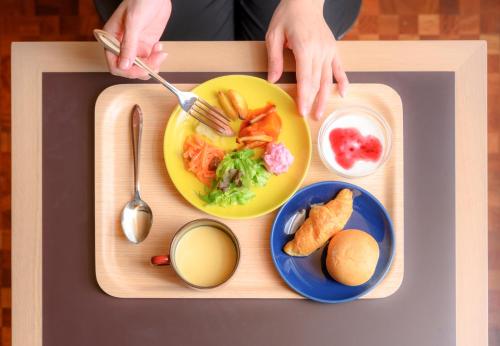 a tray with a plate of food on a table at RIHGA PLACE HIGOBASHI in Osaka