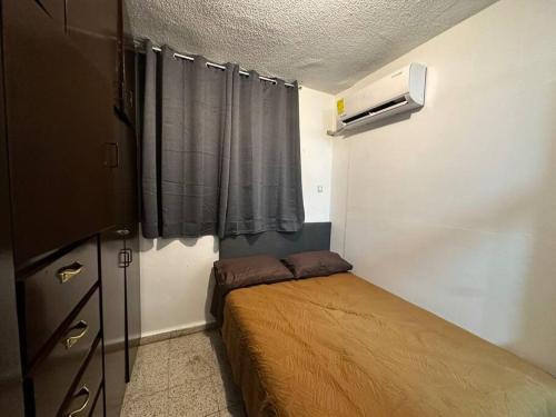 Una cama o camas en una habitación de Apartamentito Supercéntrico