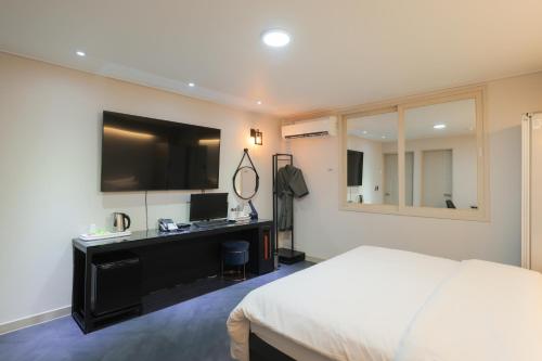 Postel nebo postele na pokoji v ubytování VIP Hotel Mokpo