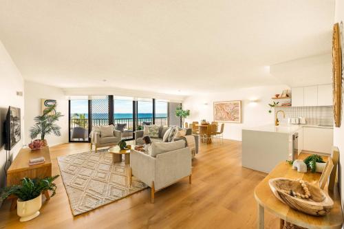 an open living room with a view of the ocean at The Rocks Resort Unit 4C in Gold Coast