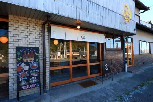a restaurant with a sign in front of a building at 奥大和ビール TAP to BED in Ōuda