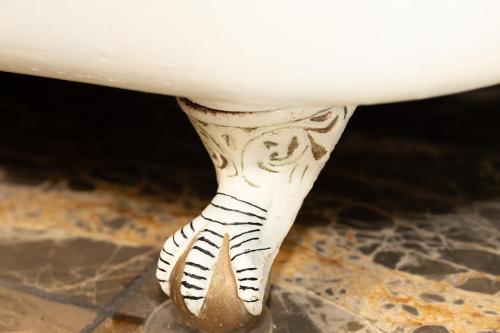 a white table with a zebra painted on it at Multi-Level Forest Lodge Near Silverwood with Vintage Ice Cream Parlor & Movie Theater in Spirit Lake