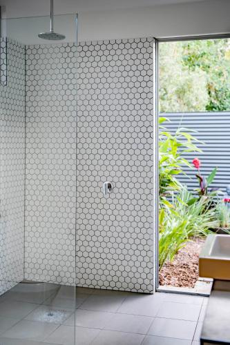 a bathroom with a shower with a glass door at Sauna Retreat - Near Town and Beach - Explorers Rest in Margaret River Town