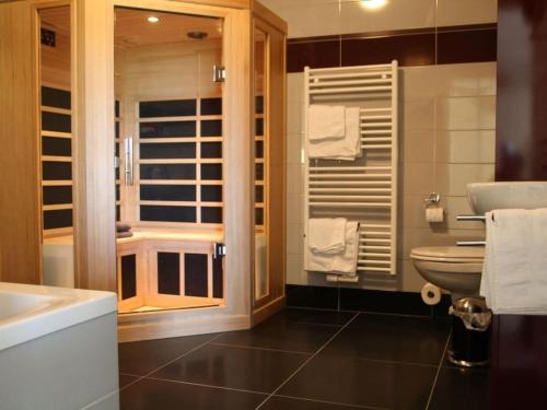 a bathroom with a sink and a toilet at "Apartment Eldeufer" in Plau am See