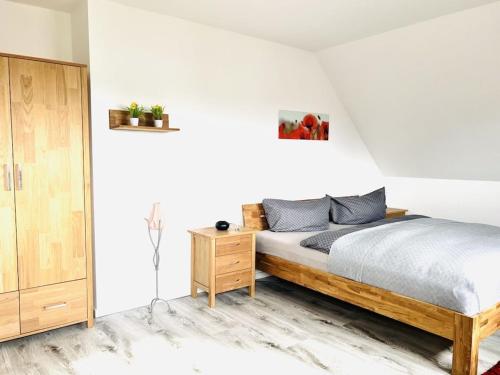 Postel nebo postele na pokoji v ubytování Rügen-Lancken-Granitz