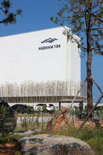 a large white truck with a sign on the side of it at Haenam 126 Hotel in Haenam