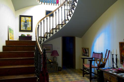 a staircase in a home with a stair case at Olmitos 3, Casa-Palacio Real Piedad in Cehegín