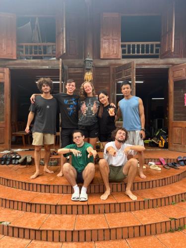 a group of people posing for a picture on steps at Pea homestay in Sa Pa