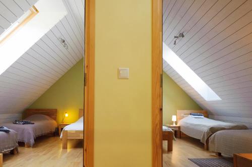 Postel nebo postele na pokoji v ubytování Rootsimaa Holiday House