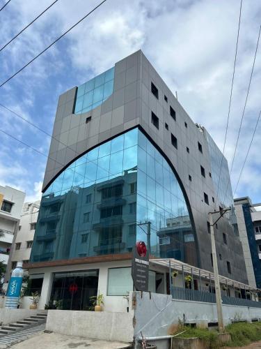 a large glass building with a glass window at Wild Wings Premium Hotel in Hyderabad