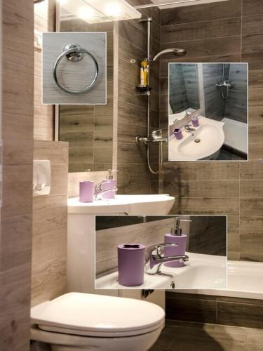 a bathroom with two sinks and a toilet at Apartment Onyx in Split