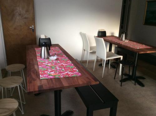 a table with a table cloth on top of it at Guesthouse Kálfafellsstadur in Kálfafellsstaður