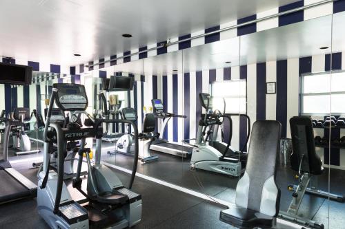 a gym with many treadms and cardio machines at Albion Hotel in Miami Beach