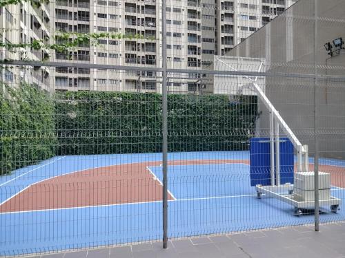 a tennis court in the middle of a city at D'Leisya Studio Youth City Nilai in Nilai