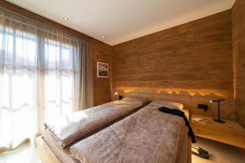 Una cama o camas en una habitación de Chalet Hinterrugg