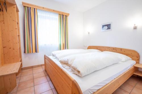 Postel nebo postele na pokoji v ubytování Chalet Hochkrimml 142