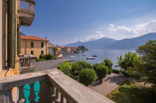 a balcony of a building with a view of the water at Casa Daniele in Menaggio