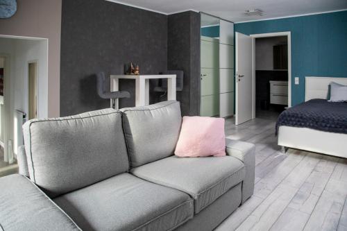 a living room with a couch and a bed at Apartment Fernwald mit Self-Check-In in Albach