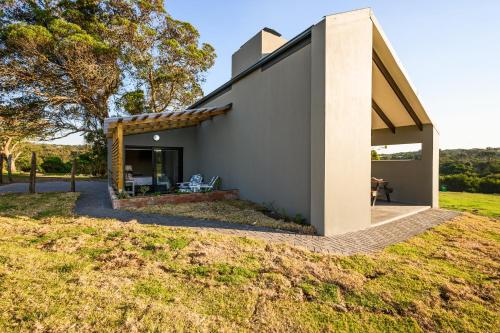 a house with a view of a yard at Kragga Kamma Game Park in Port Elizabeth