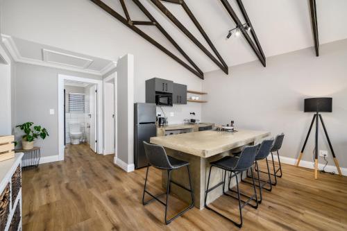 a kitchen with a table and chairs in a room at Kragga Kamma Game Park in Port Elizabeth