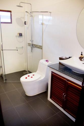 a bathroom with a toilet and a sink at Banburi Villa - 2 Bedroom Private Pool Villa in Ao Nang Beach