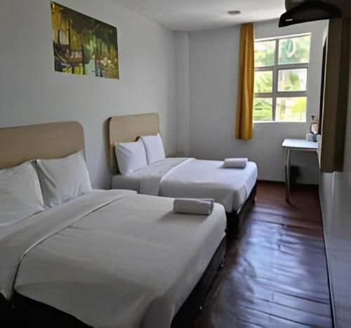 Postel nebo postele na pokoji v ubytování Santai Morib Hotel