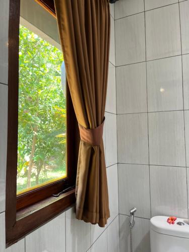 Koupelna v ubytování Bali Asli Guest House by EPS