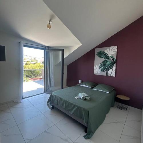Ένα ή περισσότερα κρεβάτια σε δωμάτιο στο BETEL 3 Escapade à deux pas de la plage Terre Sainte