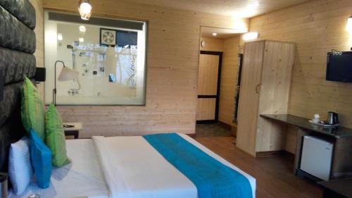 Ένα ή περισσότερα κρεβάτια σε δωμάτιο στο Winnies Holiday Resort & Spa