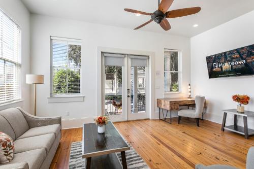 a living room with a couch and a table at Spacious 3BR Garden District Home w Pool & Balcony in New Orleans