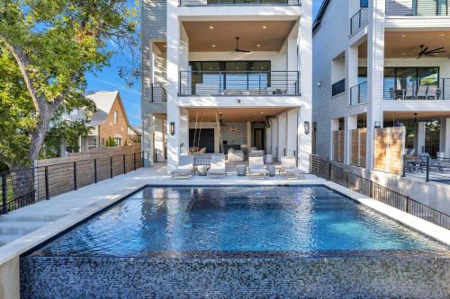 a swimming pool in the backyard of a house at Ellen Lake Luxe with Concierge Services in Kingsland