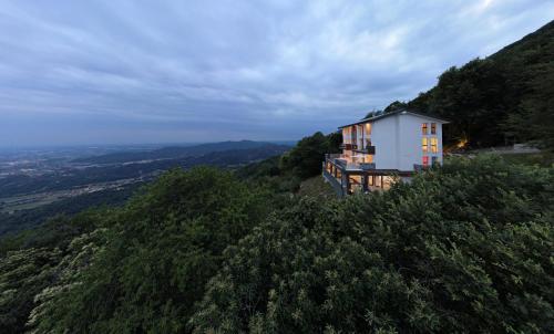 a house on the side of a hill at Loft experience Amore o Psyche a Carobais 7 in Roncola