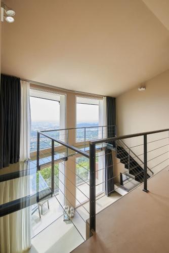 a room with a glass staircase with a view at Loft experience Amore o Psyche a Carobais 7 in Roncola