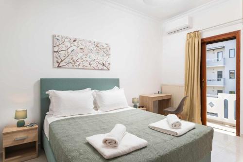 Ένα ή περισσότερα κρεβάτια σε δωμάτιο στο Somine Apartment Chania