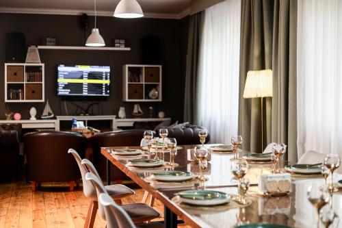 a dining room with a long table and chairs at Dacha in Astana