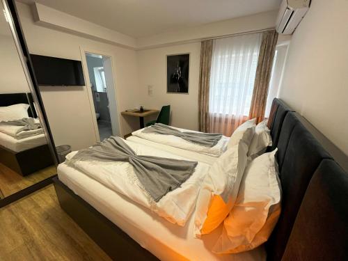 Letto o letti in una camera di Haven Hotels - Hotel Dona