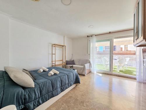 a bedroom with a bed and a large window at Atico A Cartagena centro historico Parking in Cartagena