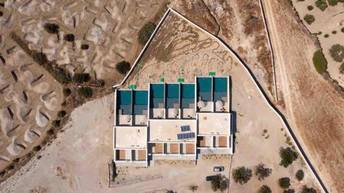 an aerial view of a building with green roof at Scylla Concept Suites in Adamas